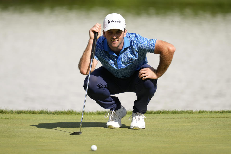 Denny McCarthy lines up his putt on the 18th green during the third round of the John Deere Classic golf tournament, Saturday, July 8, 2023, at TPC Deere Run in Silvis, Ill. (AP Photo/Charlie Neibergall)