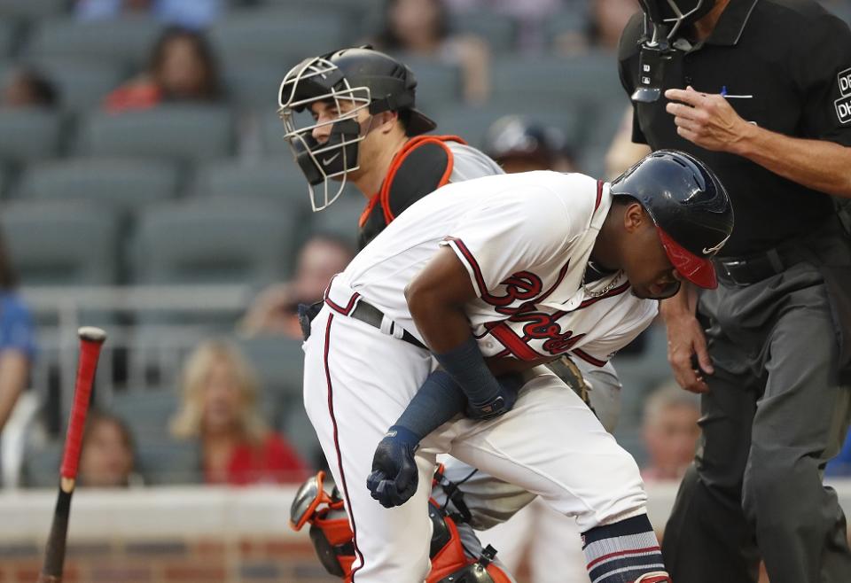 Braves rookie Ronald Acuna Jr. reacts after being hit by Marlins starter Jose Urena's first pitch. (AP)