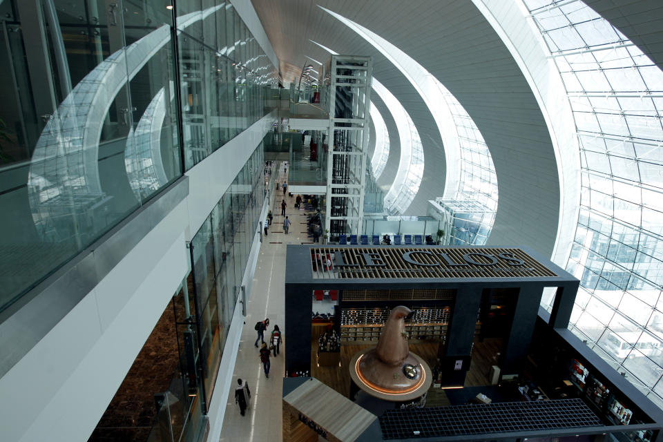 In this Sunday, Feb. 10, 2013, photo, passengers walk in the new Concourse A of Dubai airport in Dubai, United Arab Emirates. For generations, international fliers have stopped over in London, Paris and Amsterdam. Now, they increasingly switch planes in Dubai, Doha and Abu Dhabi, making this region the new crossroads of global travel. The switch is driven by both the airports and airlines, all backed by governments that see aviation as the way to make their countries bigger players in the global economy. (AP Photo/Kamran Jebreili)