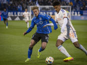 CF Montreal's Bryce Duke (10) chases FC Cincinnati's Ian Murphy for the ball during the first half of an MLS soccer match Saturday, April 13, 2024, in Montreal. (Peter McCabe/The Canadian Press via AP)