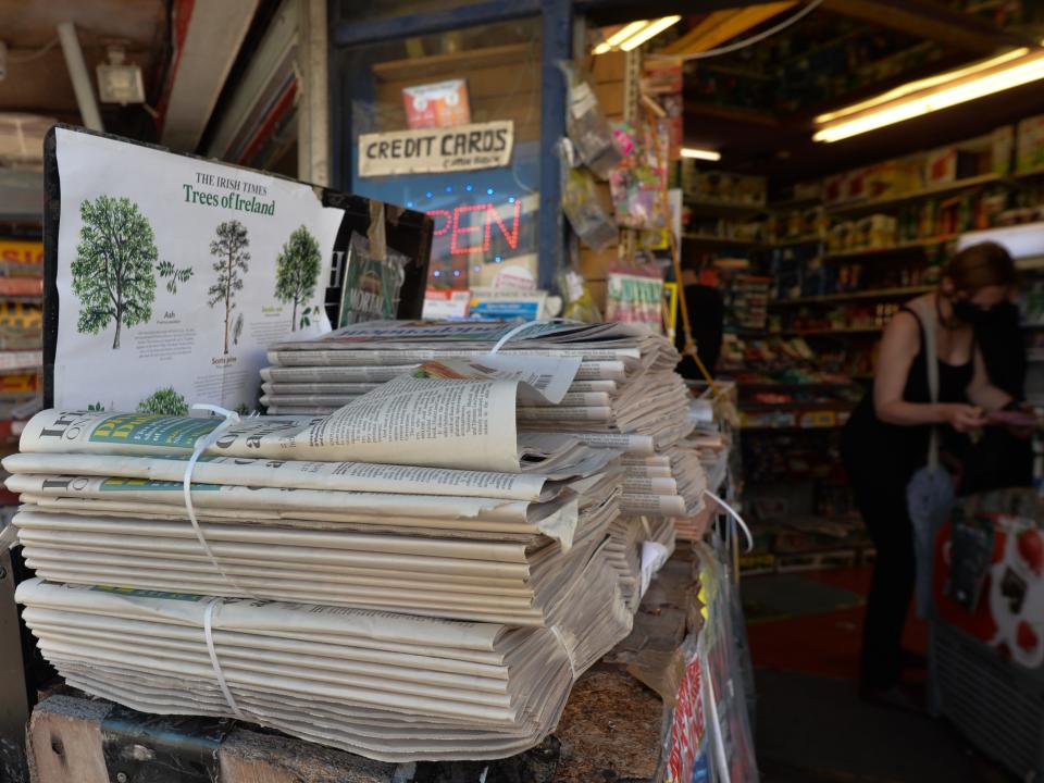 Stacked newspapers.