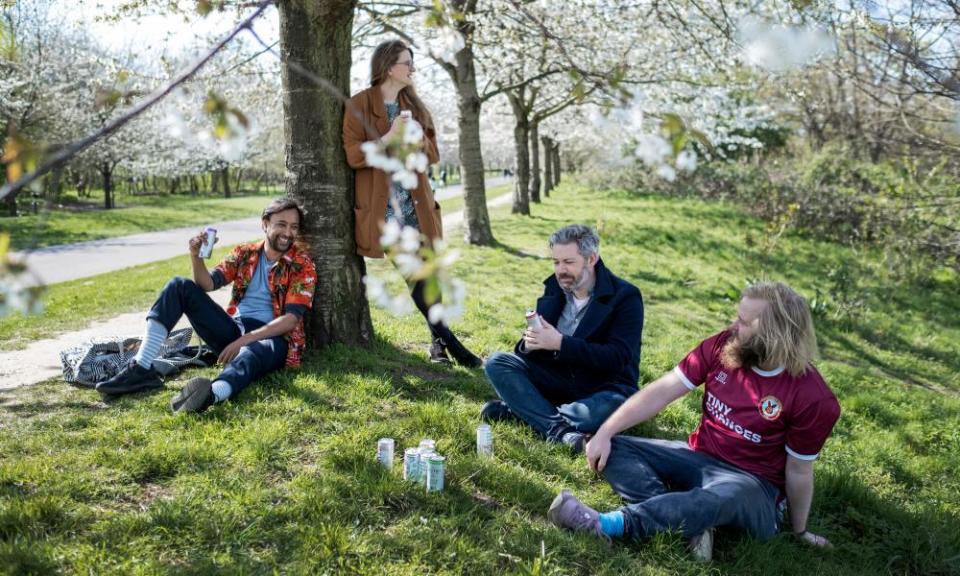 Rhik Samadder, sitting against the tree, with his friends Lauren, Tom and James.