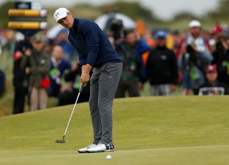 USA's Jordan Spieth holes his eagle putt on the 15th green during the final round REUTERS/Andrew Boyers