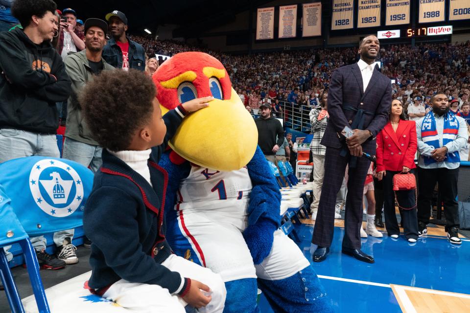 Former Kansas player Thomas Robinson and his family wait to walk on to the court at Allen Fieldhouse Saturday where Robinson's jersey was retired during halftime of the game against Missouri.