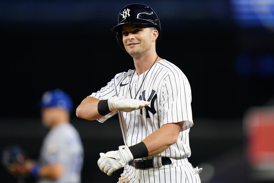FILE - New York Yankees' Andrew Benintendi gestures toward teammates after hitting an RBI-single during the eighth inning of a baseball game against the Kansas City Royals, on July 29, 2022, in New York. The Chicago White Sox agreed to a $75 million, five-year contract with All-Star outfielder Andrew Benintendi, a person familiar with the situation said Friday, Dec. 16, 2022. (AP Photo/Frank Franklin II)