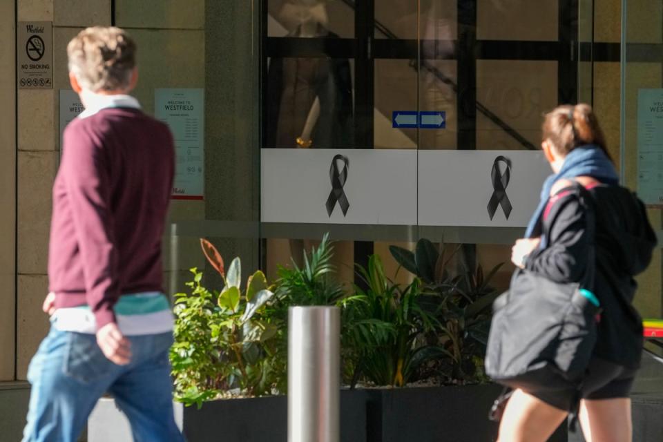 People walk past the entrance to the Westfield mall at Bondi Junction in Sydney (Copyright 2024 The Associated Press. All rights reserved)