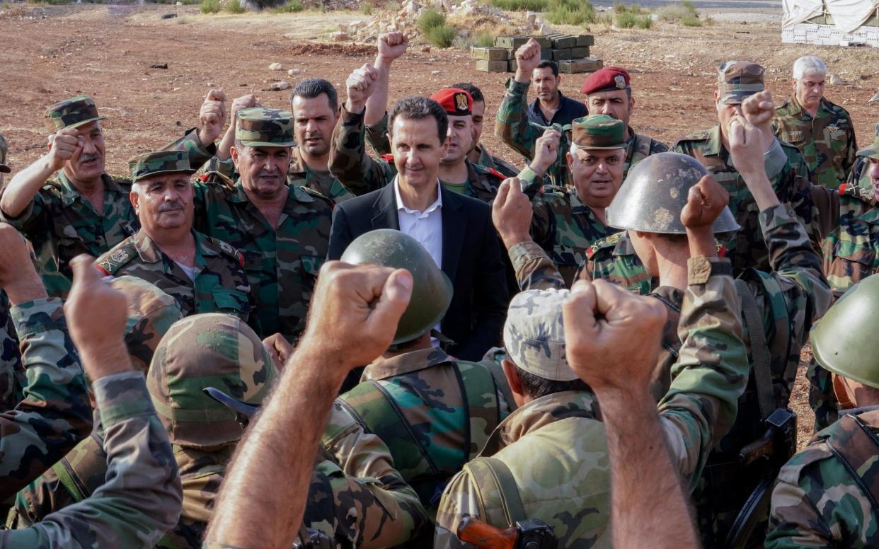 Syrian President Bashar al-Assad visits Syrian army troops in war-torn northwestern Idlib province - REUTERS