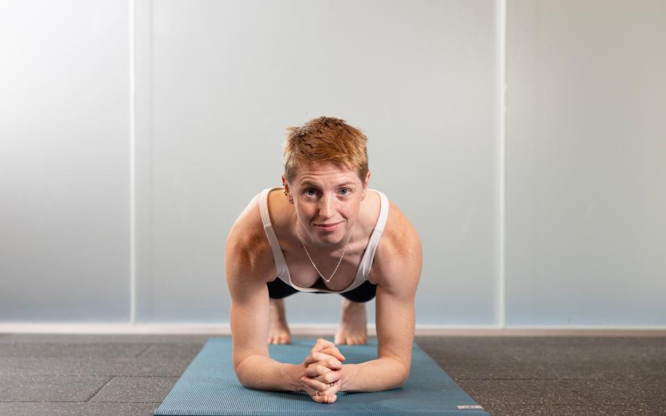 Boudicca Fox Leonard demonstrates the forearm plank, an isometric core-strength exercise