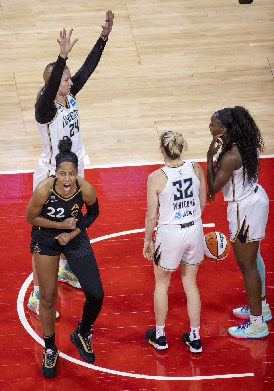 Las Vegas Aces forward A'ja Wilson (22) is pumped up after a score and a foul by New York Liberty forward Kylee Shook (24) during the first quarter of a WNBA basketball game Thursday, June 17, 2021, in Las Vegas. (L.E. Baskow/Las Vegas Review-Journal via AP)