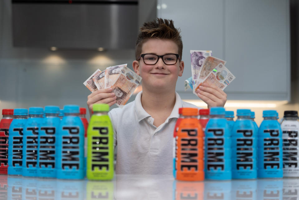 Charlie Smith, 10 of Nottingham who is selling his empty Prime bottles. January 07, 2023.  See SWNS story SWNJprime.  A budding â€œLittle Del Boyâ€ has made a tasty profit by re-selling EMPTY bottles of Prime energy drink online to punters dying to get their hands on the viral beverage.  Charlie Smith, ten, braved excessive queues outside Asda stores last month to get his hands on the viral drink, which was created by YouTube stars Logan Paul and KSI.  But after guzzling the beverages, he turned the empties into reddies by flogging them on his mum's eBay account â€“ and made more than they cost to buy in shops.  Charlie's first sale netted him Â£12 for five empty bottles of Prime, which normally retail for Â£1.99 in supermarkets such as Asda and Aldi.  And following this success, heâ€™s even started paying other youngsters Â£1 for their empty bottles in the hope of pocketing a better margin on the open market. 