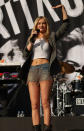 Laura Whitmore showed off her toned stomach in a crop top and denim shorts as she took to the stage [Splash]