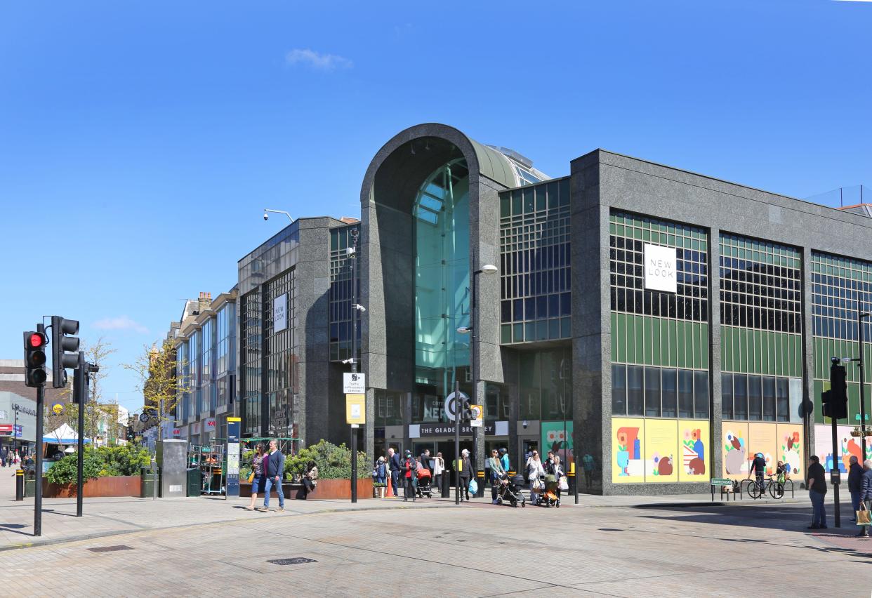 Bromley town centre on a busy summer day. Shows High Street entrance to The Glades Shopping Mall.