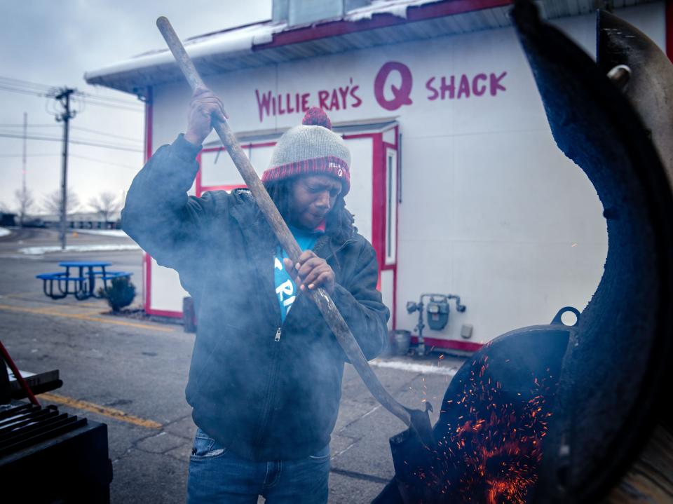 Willie Ray Fairley, the owner of Willie RayÕs ÒQÓ Shack, starts the grills as the sun rises over Cedar Rapids, Thursday, Nov. 17, 2022.