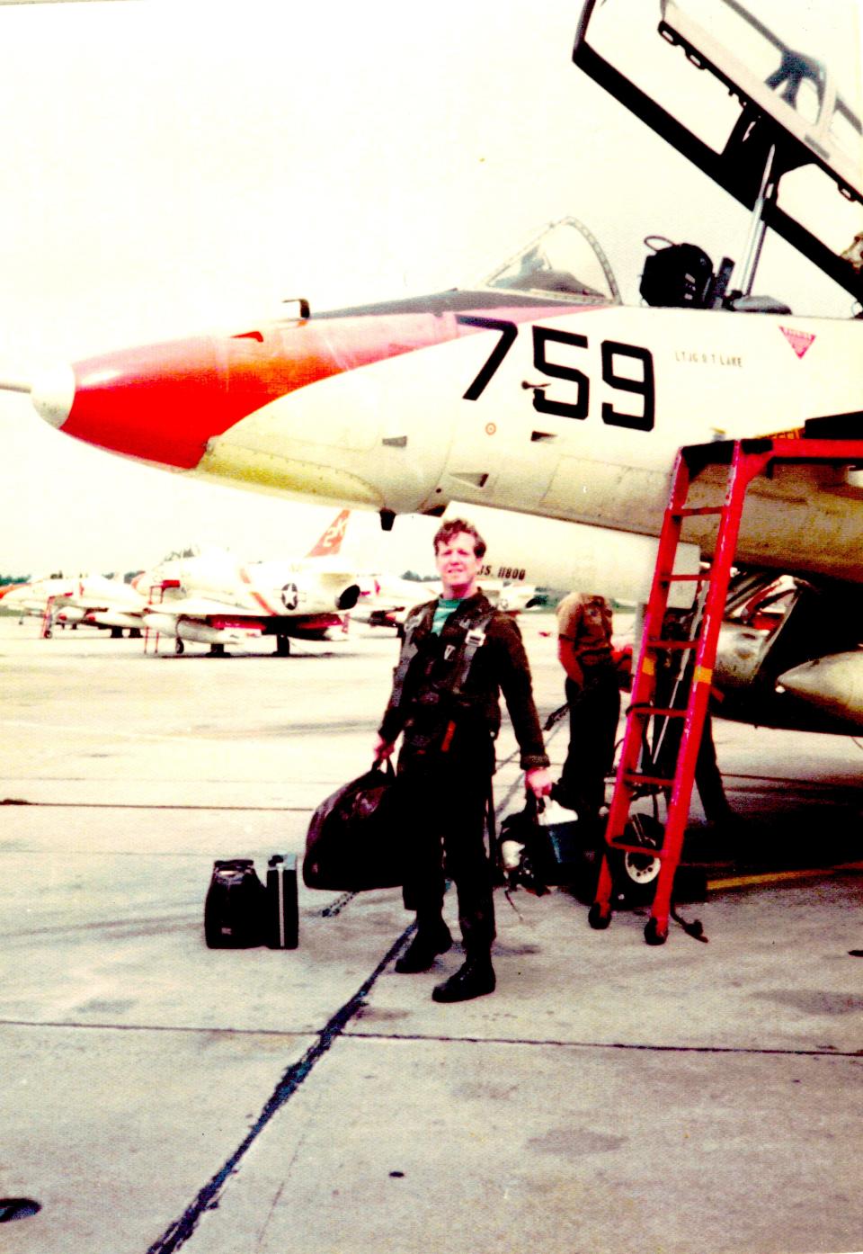 Bernard Mulligan stands in front of an A-4 Skyhawk in Pensacola.