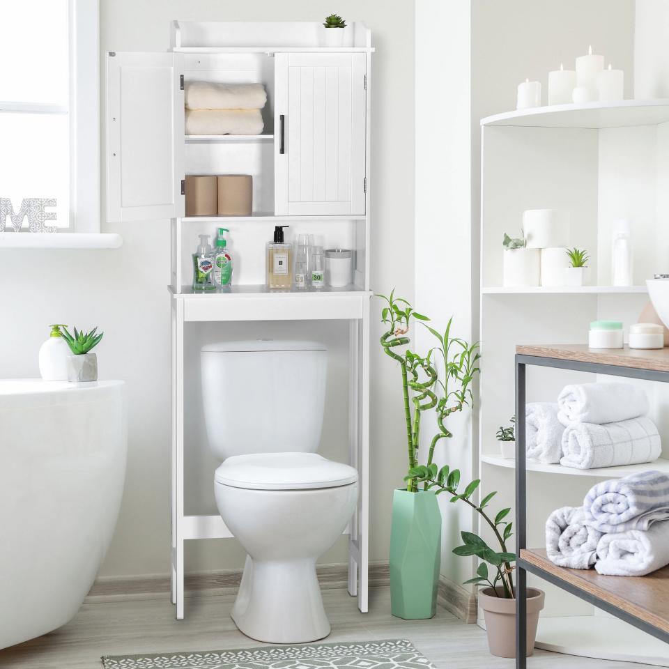 white over the toilet storage cabinet in a bathroom