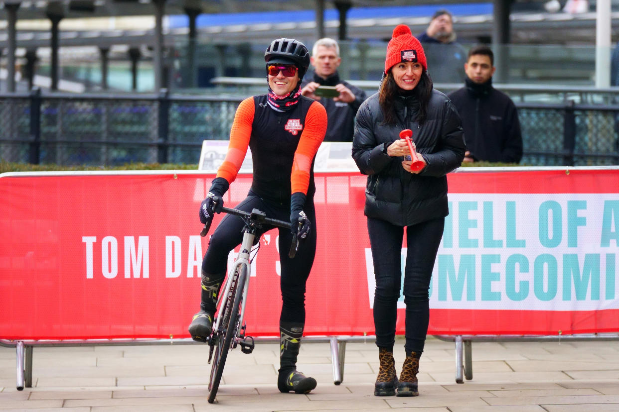 Olympic diver Tom Daley and TV presenter Davina McCall at the start line for Tom's bike ride from the Tower of London during his Comic Relief challenge, a gruelling journey from London Aquatic Centre in Stratford, east London, where he won his first Olympic medal in 2012, to his home town of Plymouth. Picture date: Monday February 14, 2022.