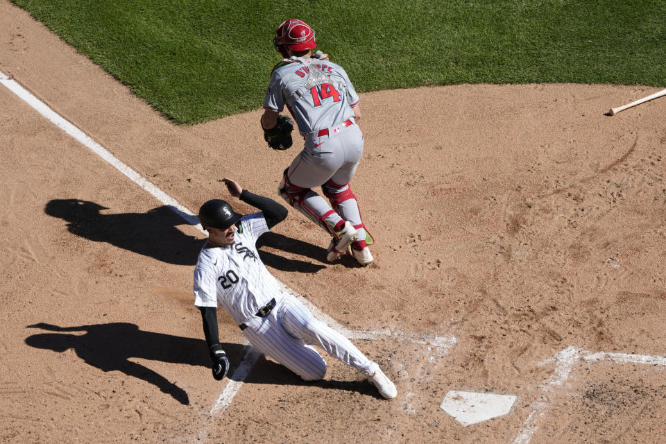 Chicago White Sox's Miguel Vargas scores past Los Angeles Angels catcher Logan O'Hoppe, off Andrew Vaughn's two-run single during the fifth inning of a baseball game Thursday, Sept. 26, 2024, in Chicago. (AP Photo/Charles Rex Arbogast)