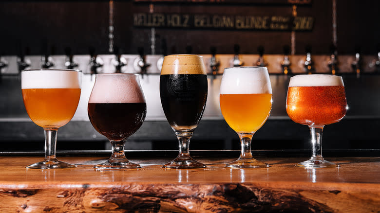 variety of beers in glasses