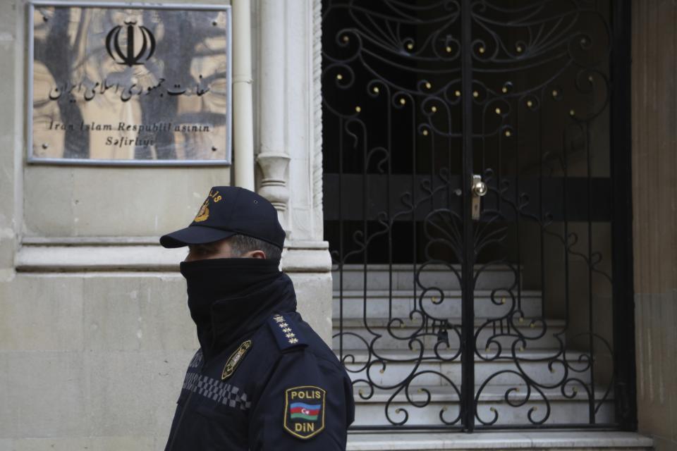 A police officer guards an area in front of the Iranian Embassy in Baku, Azerbaijan, Friday, Jan. 27, 2023. According to Azerbaijan's Foreign Ministry a man armed with a Kalashnikov-style rifle attacked the Azerbaijan Embassy in Iran's capital Tehran, killing the head of security at the diplomatic post and wounding two guards. (AP Photo/Aziz Karimov)