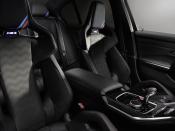 <p>M stripes are also found on the headrests for the front and rear seats. M Carbon Bucket seats seats are a $3800 option.</p>