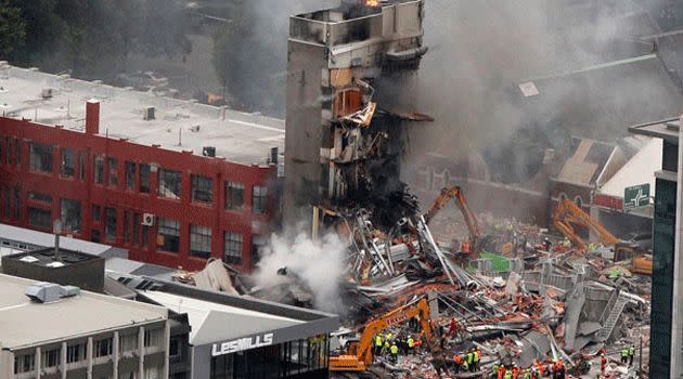 Fire fighting squads run to take care of the damage left behind by the earthquake that struck in New Zealand