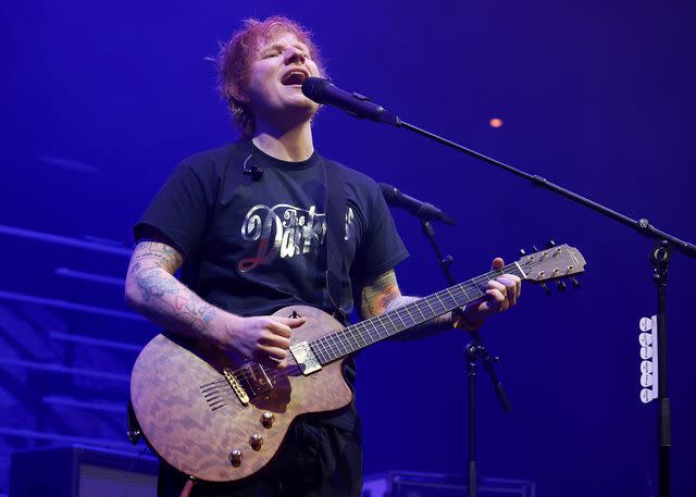 <p>Simone Joyner/Getty</p> Ed Sheeran performs live onstage in London in December 2023