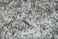 Muslim pilgrims leave Grand Mosque, after offering Friday prayers ahead of the annual Hajj pilgrimage, in the Muslim holy city of Mecca, Saudi Arabia, early Friday, Aug. 17, 2018. The annual Islamic pilgrimage draws millions of visitors each year, making it the largest yearly gathering of people in the world. (AP Photo/Dar Yasin)