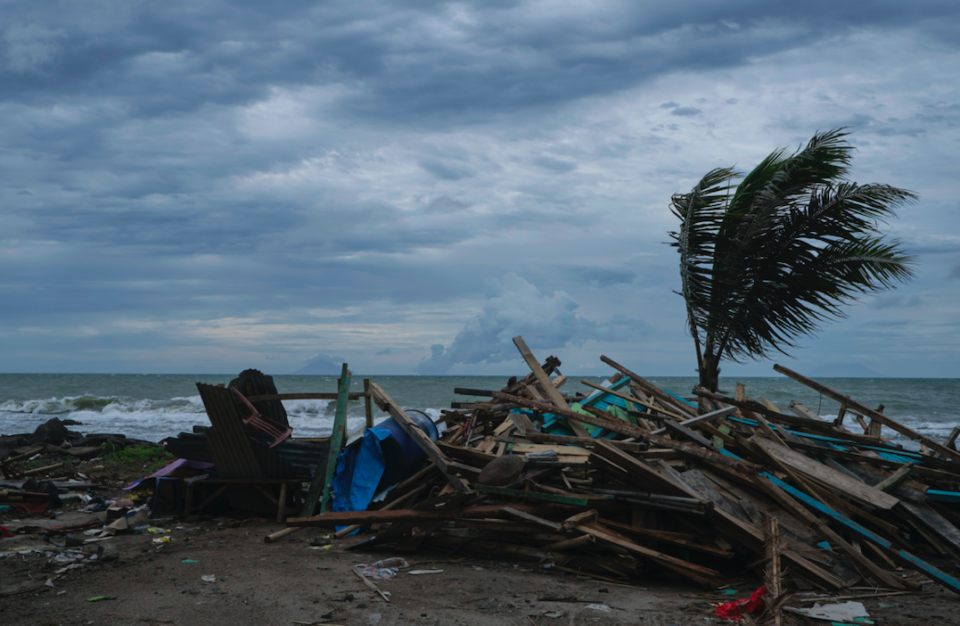 <em>The eruption of the island volcano sent a 20 metre-high wall of water inland, damaging hotels and houses (Getty)</em>