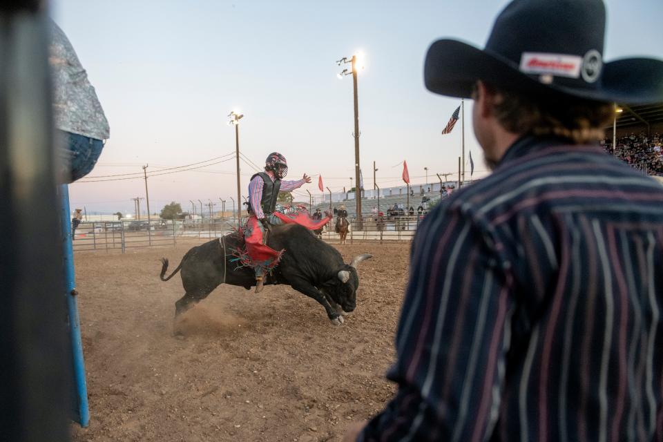 A 2022 photo shows Justin Rickard riding a bull during the San Bernardino County Fair in Victorville.