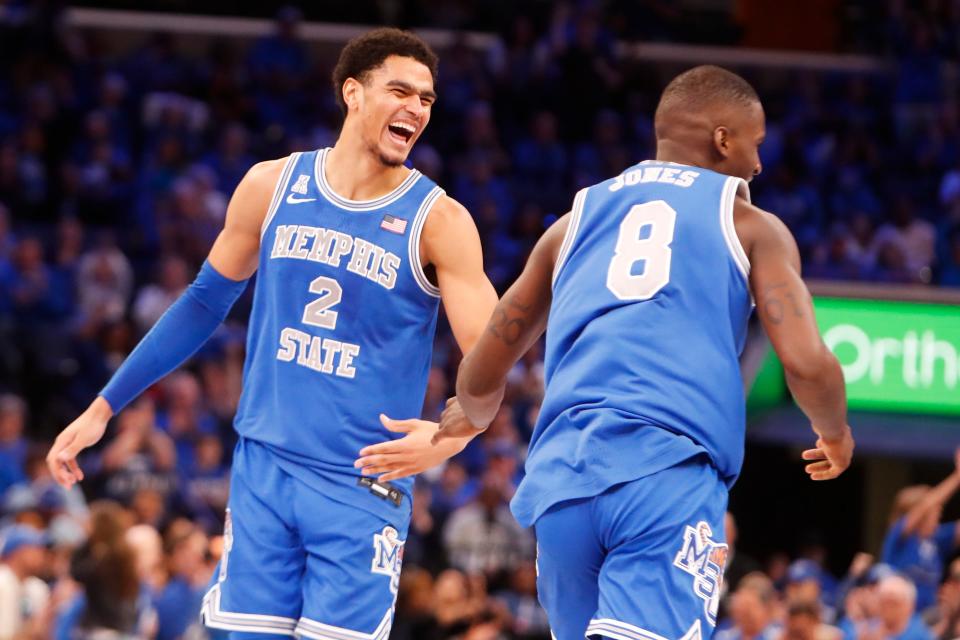Memphis' Nick Jourdain (2) and David Jones (8) high-five and smile after they scored during the game between University of Alabama at Birmingham and University of Memphis at FedExForum in Memphis, Tenn., on Sunday, March 3, 2024.