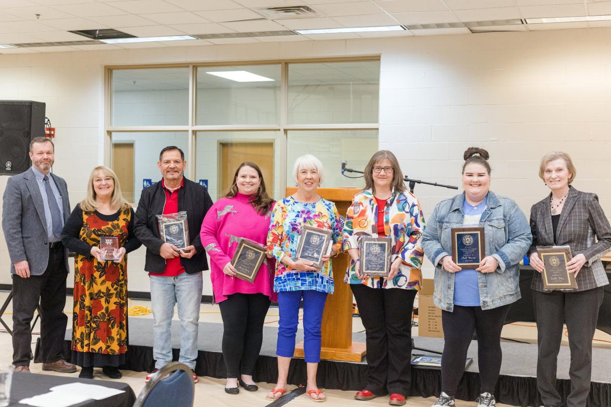 Left to right, Dr. Justin Lawrence, Pam Landis, Dr. Joshua Mora, Mandy Berry, Pam Kennedy, Dr. Ann Stutes, Holli Wauson, and Debbe Fikes pose with their faculty and staff awards at Wayland Baptist University's annual Employee Awards Luncheon on April 6.