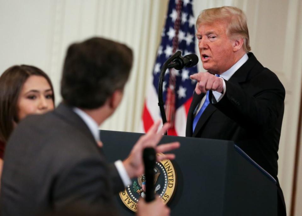 An angry Trump reacts to CNN reporter Jim Acosta (PA)