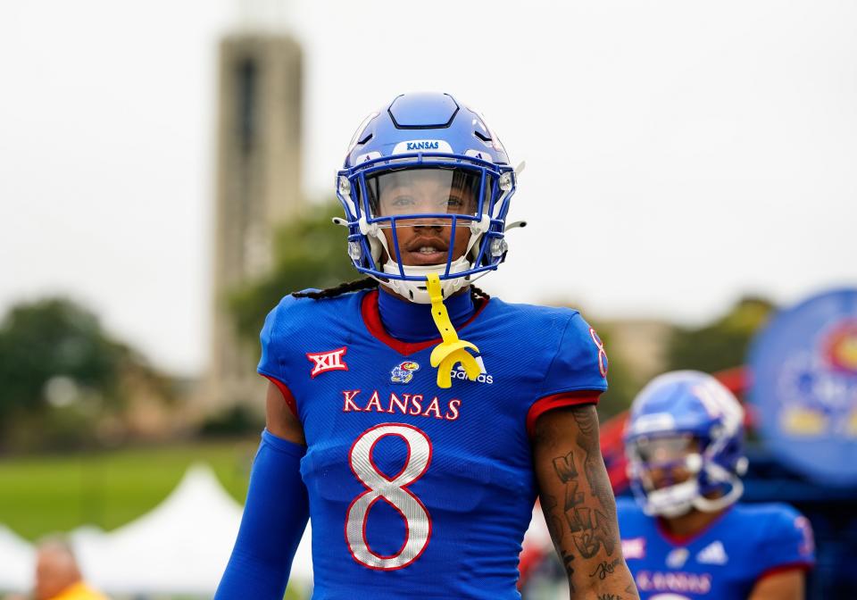 Kansas wide receiver Kwamie Lassiter II (8) takes the field before the game against the Oklahoma Sooners at David Booth Kansas Memorial Stadium on Oct. 23, 2021.