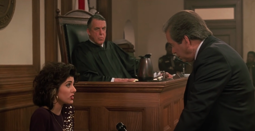 A woman and a lawyer prepare for questioning