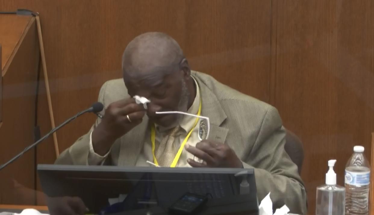 In this image from video, witness Charles McMillian becomes emotional as he answers questions on March 31 during the trial of former Minneapolis police Officer Derek Chauvin at the Hennepin County Courthouse in Minneapolis, Minn.  