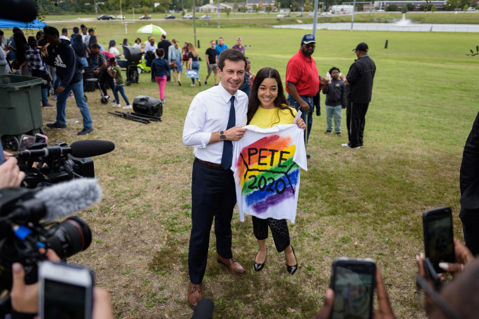 Mayor Pete Buttigieg of South Bend, Ind. poses for a photo with Kashmir Imani, holding a T-shirt she designed, during a homecoming tailgate event at Allen University, a historically black campus in Columbia, S.C., on Oct. 26, 2019. | Bryan Cereijo—The New York Times/Redux