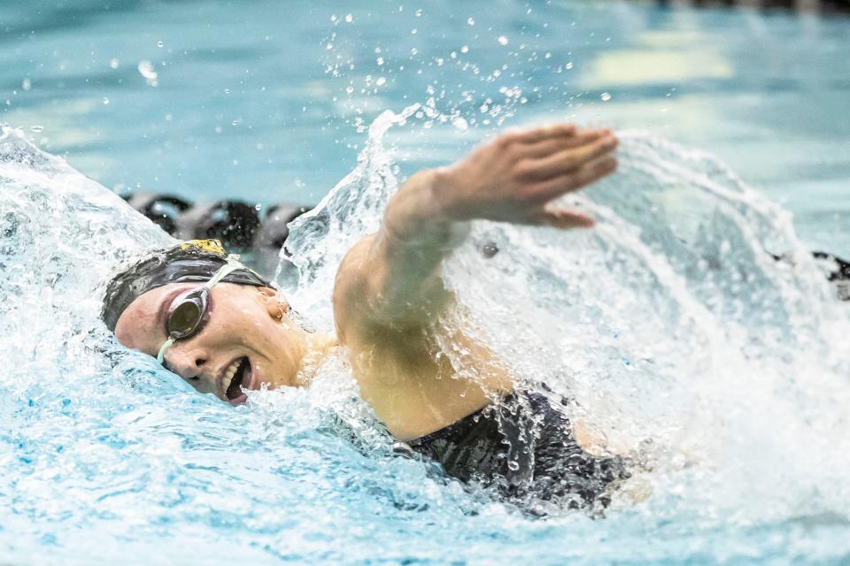 Penn’s Lilian Christianson competes in the 100-yard freestyle event during the girls sectional swimming preliminaries Thursday, Feb. 2, 2023 at Penn High School.