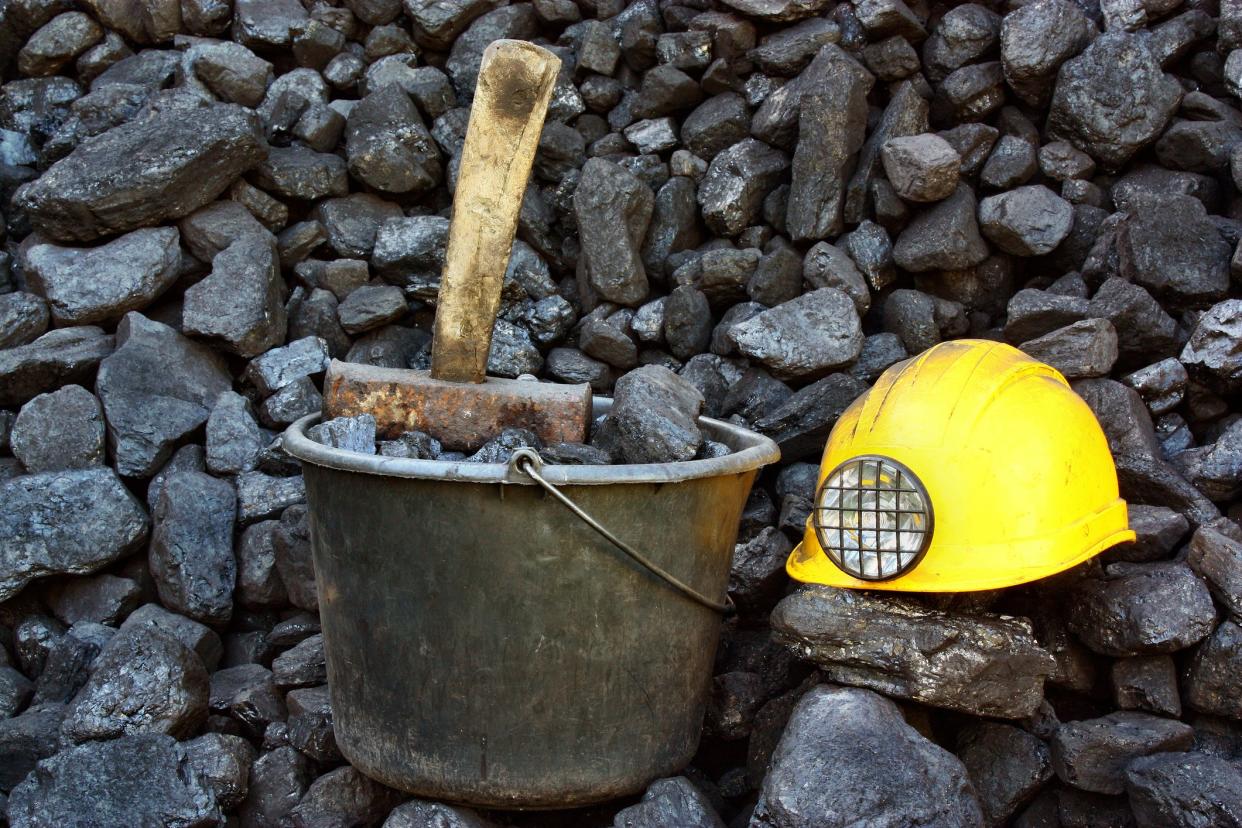 Mining tools on a background of coal