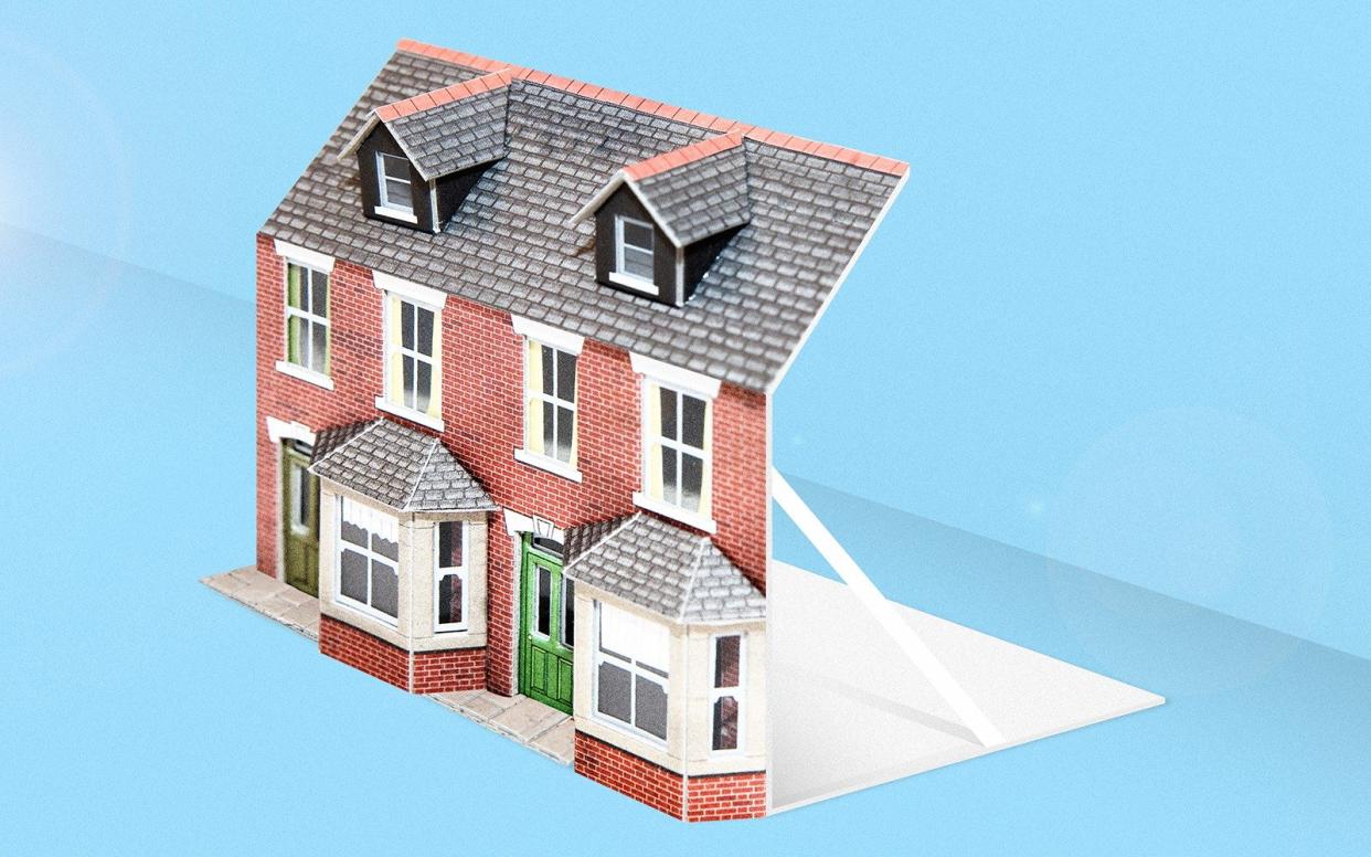 Cardboard cut-out of house to suggest fake house