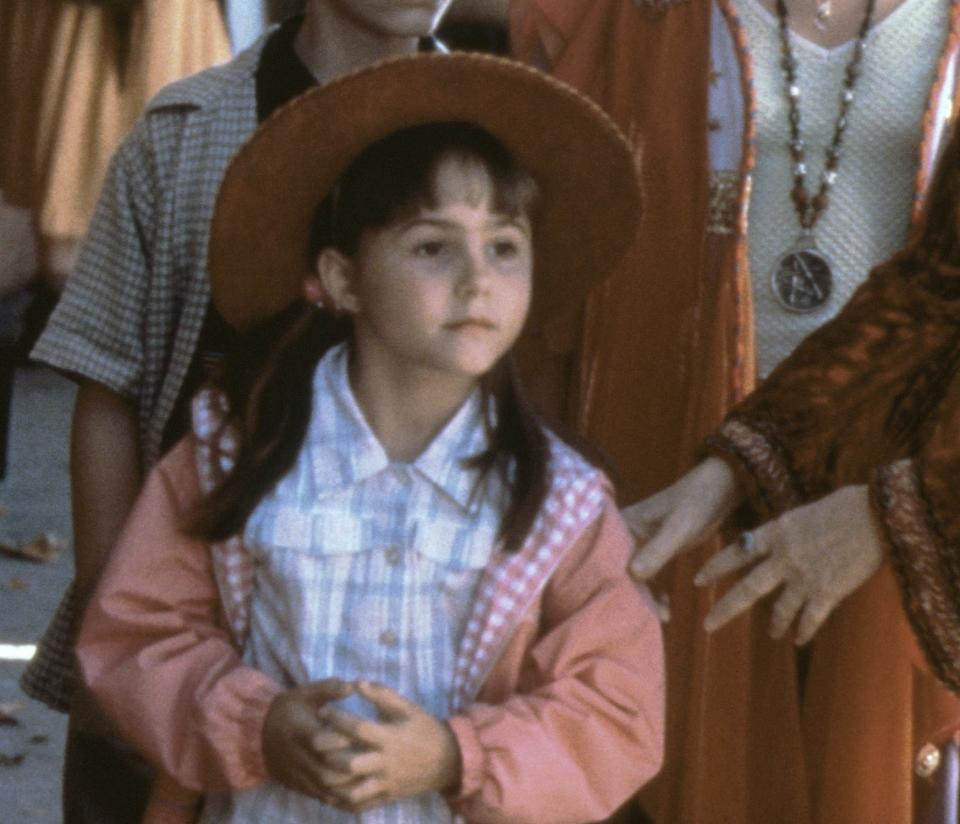 young sofie wearing a sun hat