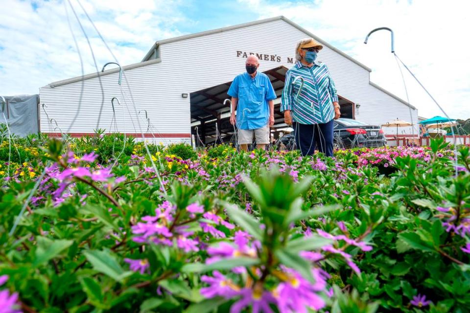 Marilyn Henderson and Charlie Hanson shop for flowers at the Pee Dee State Farmers Market. The Pee Dee State Farmers market is set to host the Plant and Flower Sale April 22-25. The event, expected to bring over up to 22,000 visitors, was closed last year due to the COVID-19 pandemic. The three state farmers markets in S.C. were set up by the S.C. Department of Agriculture to support local farming in the region. April 15, 2021.