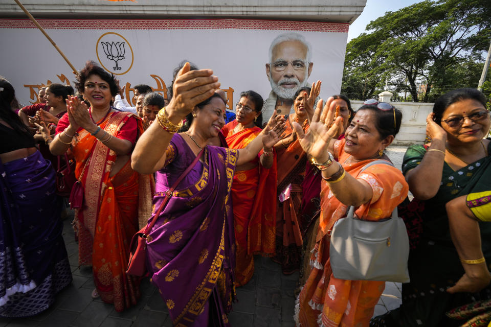Bharatiya Janata Party (BJP) supporters dance at the party office during the counting in India's national election, in Guwahati, India, Tuesday, June 4, 2024. Prime Minister Narendra Modi's Hindu nationalist party showed a comfortable lead Tuesday, according to early figures reported by India's Election Commission, but was facing a stronger challenge from the opposition than had been expected. (AP Photo/Anupam Nath)
