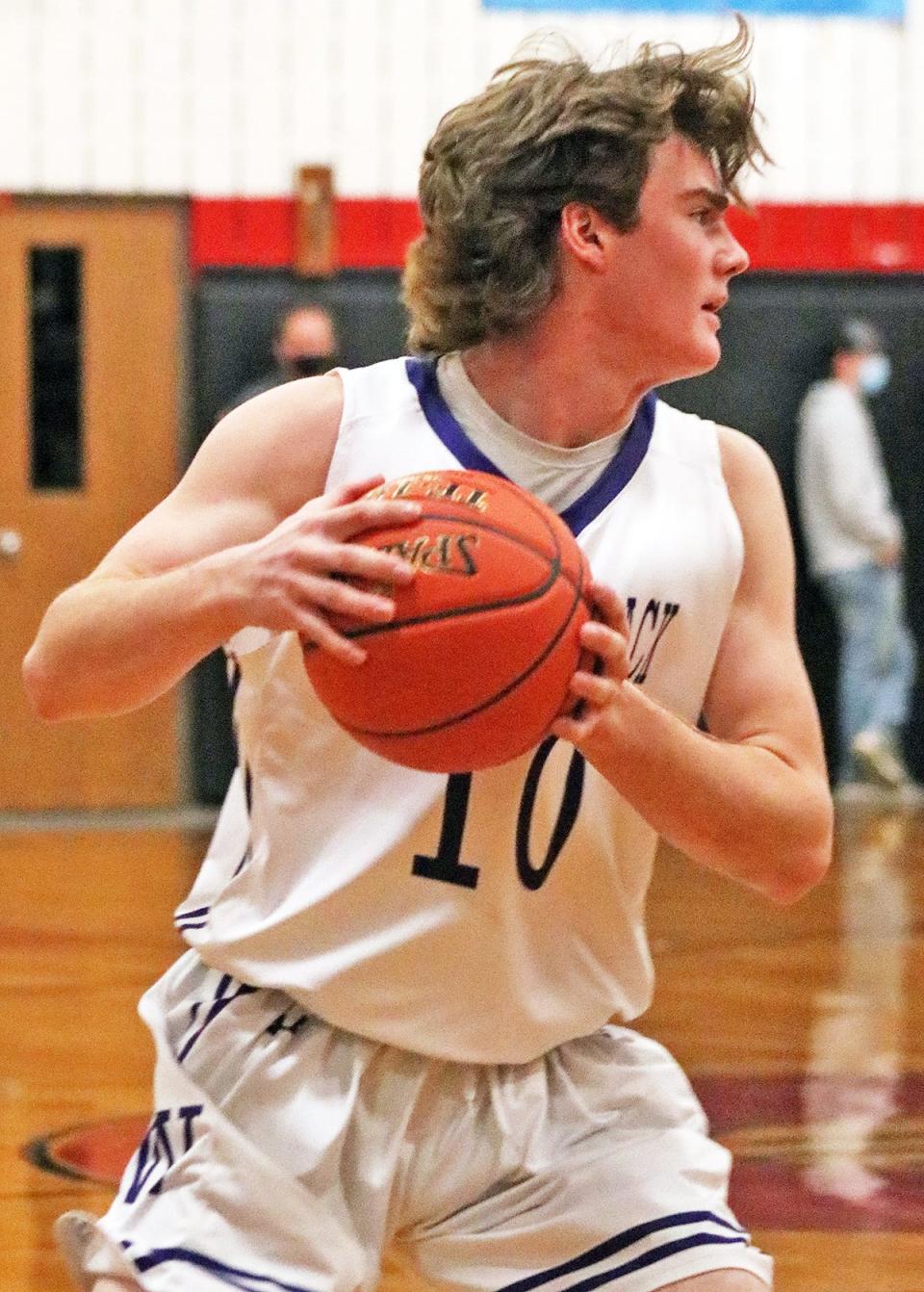 Wyatt Peifer of Wallenpaupack Area looks for an open teammate against archrival Honesdale in Lackawanna League boys varsity hoops action.