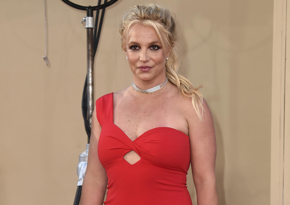 FILE - Britney Spears arrives at the Los Angeles premiere of "Once Upon a Time in Hollywood" on July 22, 2019. When Spears speaks to a judge at her own request on Wednesday, June. 23, 2021, she'll do it 13 years into a court-enforced conservatorship that has exercised vast control of her life and money by her father. Spears has said the conservatorship saved her from collapse and exploitation. But she has sought more control over how it operates, and says she wants her father out. (Photo by Jordan Strauss/Invision/AP, File)