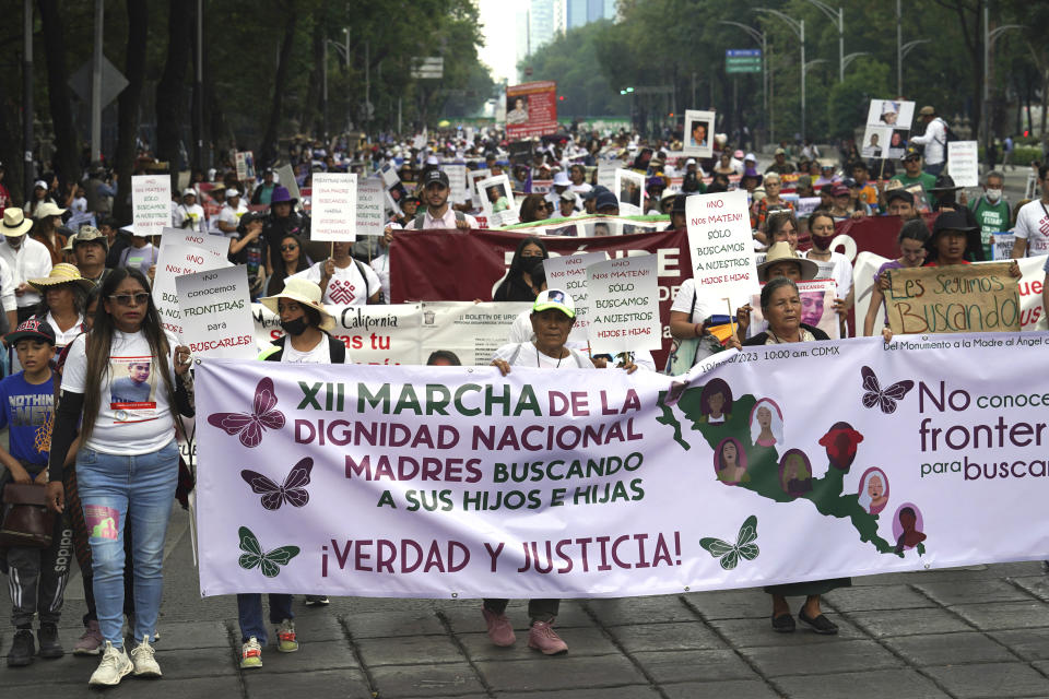 Mothers of disappeared children march to demand government help in the search for their missing loved ones on Mother's Day in Mexico City, Wednesday, May 10, 2023. (AP Photo/Marco Ugarte)