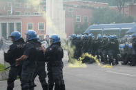Roma fans riot with police ahead the Italian Serie A soccer match between Lazio and Roma at Rome's Olympic stadium, Sunday, March 19, 2023. (AP Photo/Gregorio Borgia)