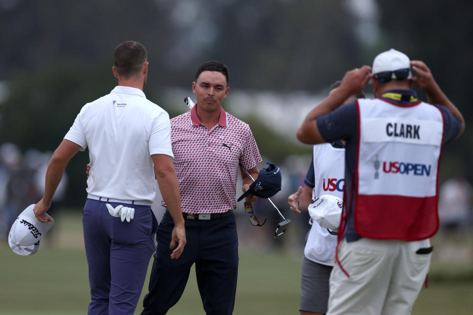 Wyndham Clark and Rickie Fowler shake hands