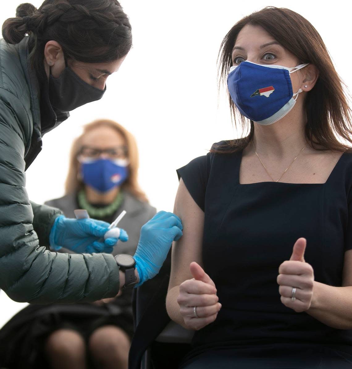 Dr. Mandy Cohen, Secretary of the North Carolina Department of Health and Human Services, reacts as she receives the Johnson & Johnson COVID-19 vaccination on Friday, March 5, 2021 at PNC Arena in Raleigh, N.C.