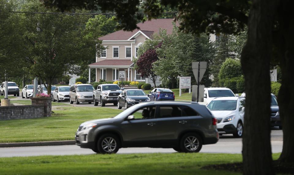 A line of traffic along the Northwest Avenue link to Tallmadge Circle waits to enter the circle.