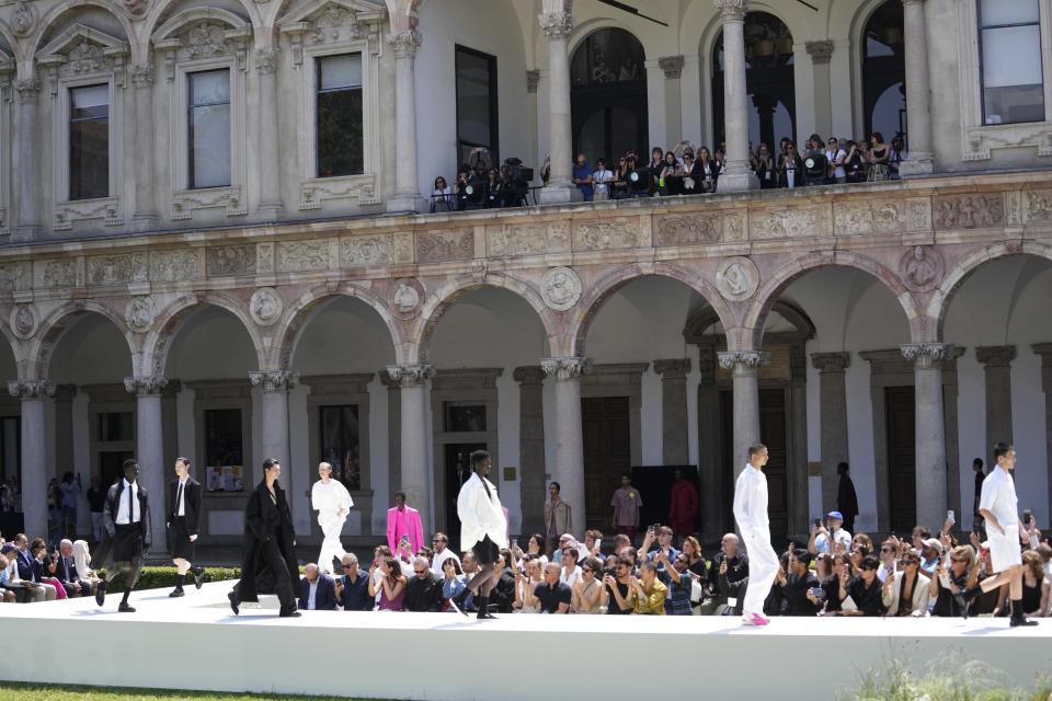 Models wear creations as part of the Valentino men's Spring Summer 2024 collection presented in Milan, Italy, Friday, June 16, 2023. (AP Photo/Luca Bruno)